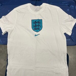 Nike White Tee with Blue Lion Emblem
